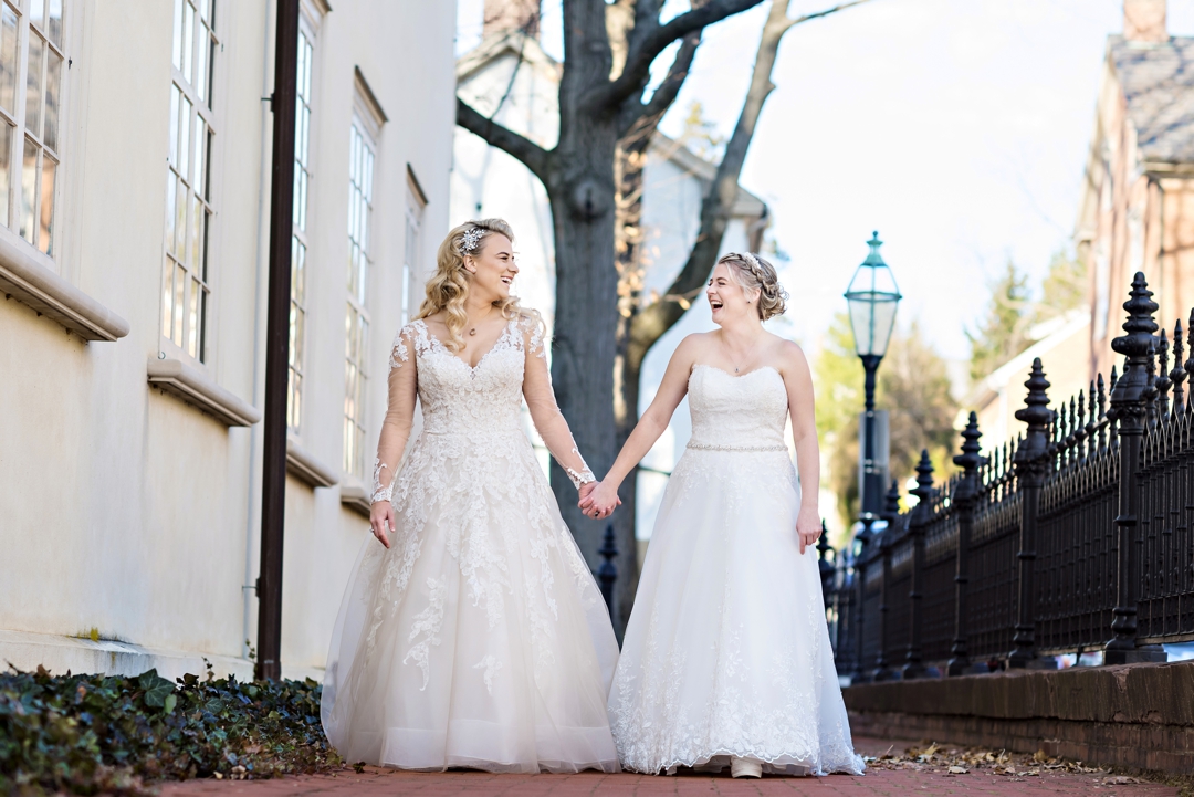 A newly married couple walk along to brick walkway at Hotel Bethlehem.