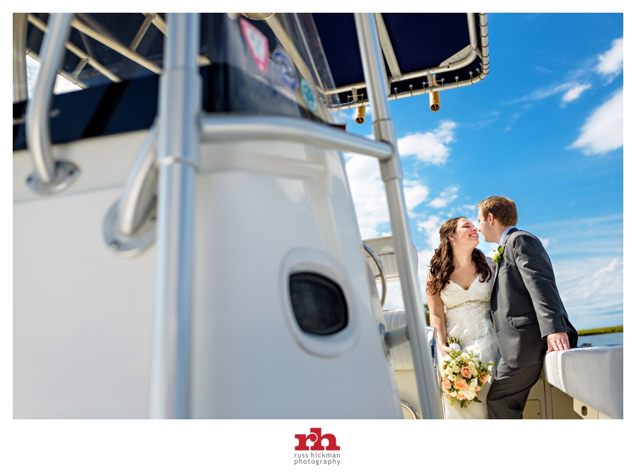 A wedding couple enjoys a moment on a yacht after their Sea Isle City NJ Wedding