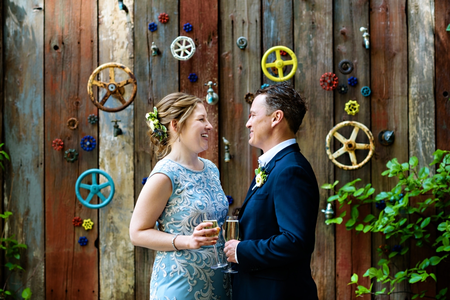 A newly married couple toast champagne after their Talula's Garden Wedding in Philadelphia.