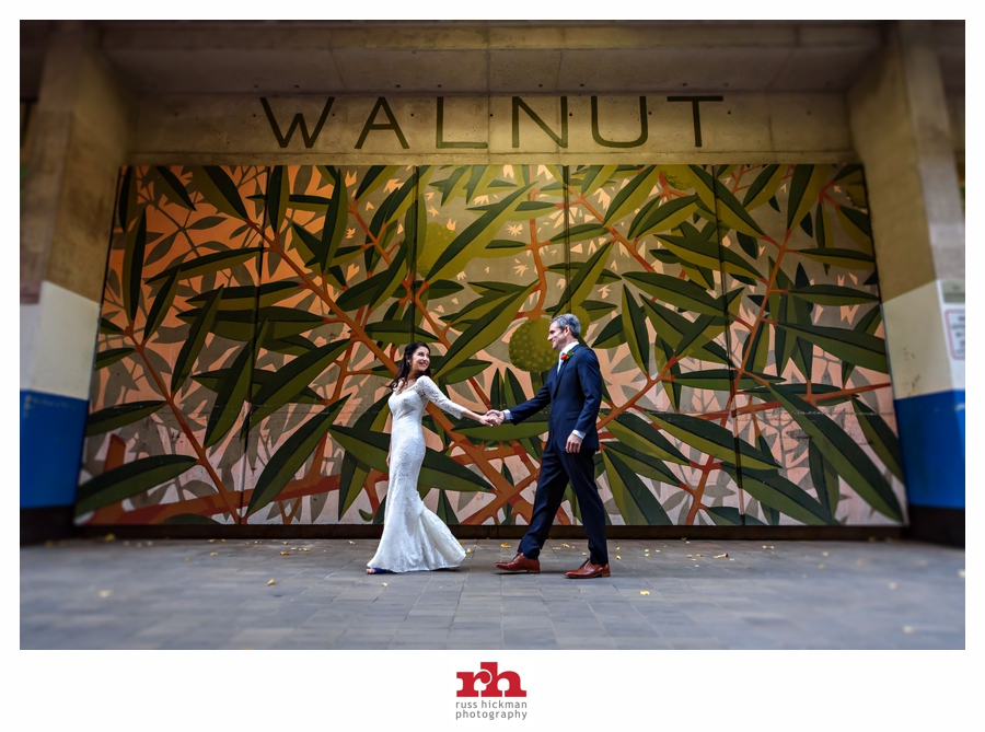 A newly married couple walk along Walnut Street in Philadelphia for their Jewish Wedding.