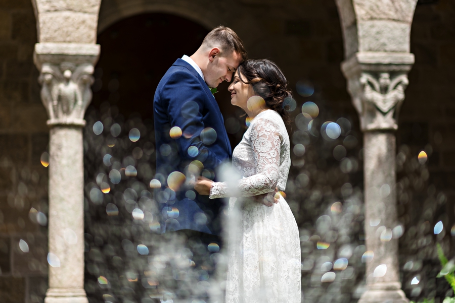 A bride and groom hold each other in a fountain at Cairnwood Estate.