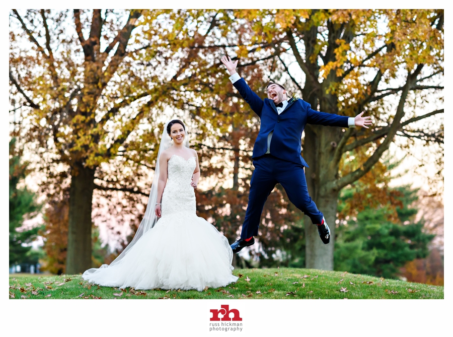 A Newly Married couple jump for joy right after their Bucks County Wedding at Northampton Valley Country Club.