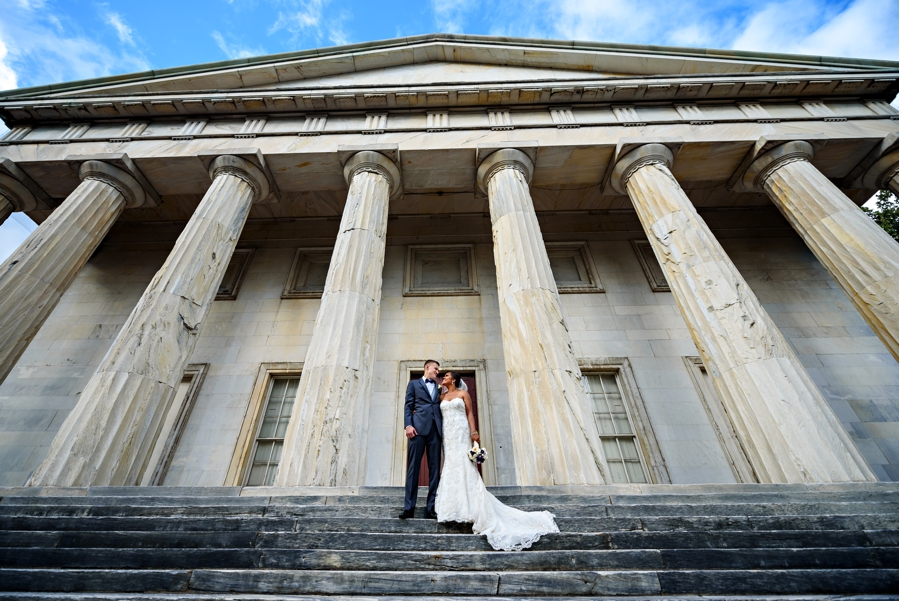 A bride and groom on the steps of the 2nd Bank of the United States in Philadelphia.