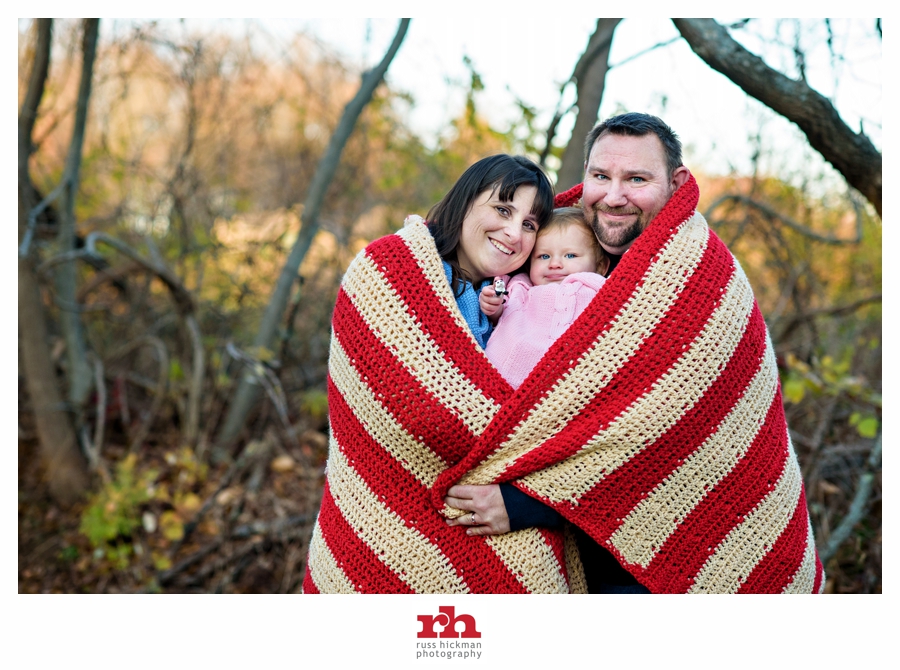 A family wraps up in a blanket during their Family Portrait Session near Philadelphia.