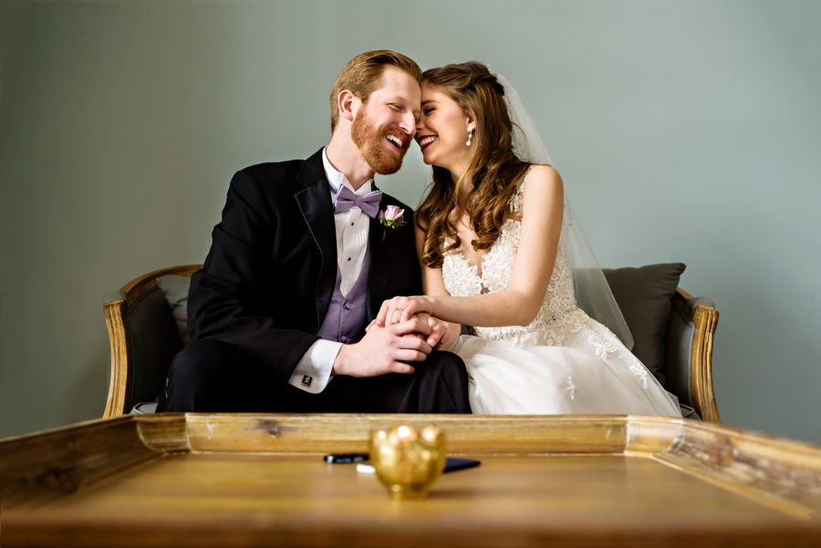 A wedding couple in love enjoy a moment in their bridal suite after their first look at Water Works in Philadelphia.