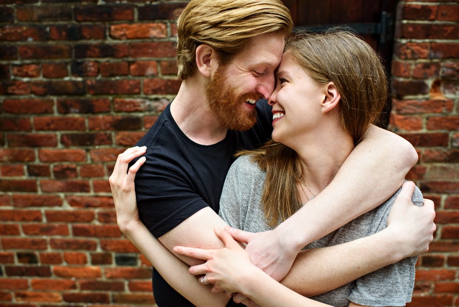 An engaged couple enjoy a loving moment during their Philadelphia Engagement Session.